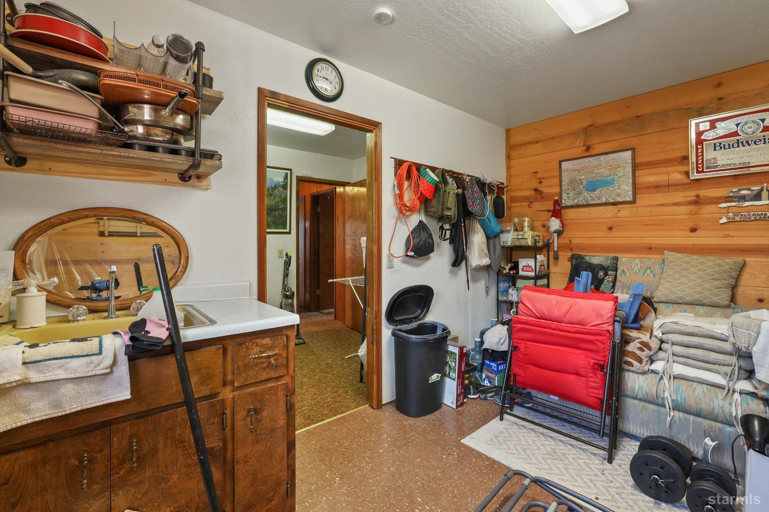 2051 Huckleberry Road Twin Bridges, CA 95735 - Photo 27 of 40 a living room with furniture a flat screen tv and a fireplace