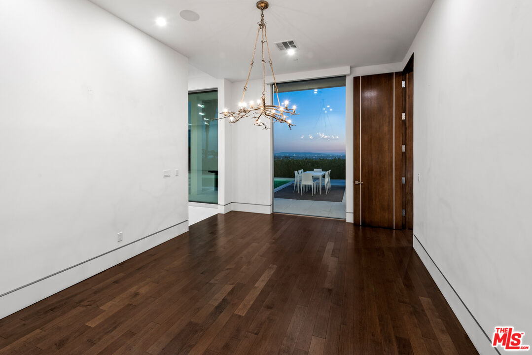 1115 Wallace Ridge Beverly Hills, CA 90210 - Photo 13 of 18 a view of a hallway with wooden floor