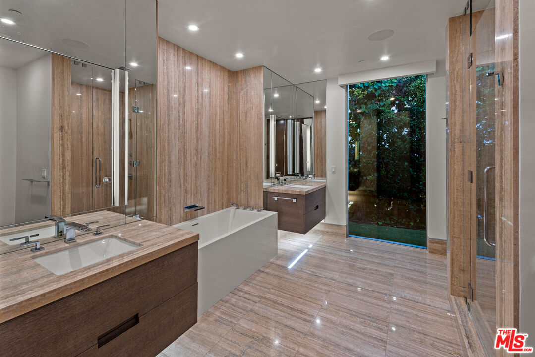 1115 Wallace Ridge Beverly Hills, CA 90210 - Photo 18 of 18 a bathroom with a double vanity sink a mirror and a shower