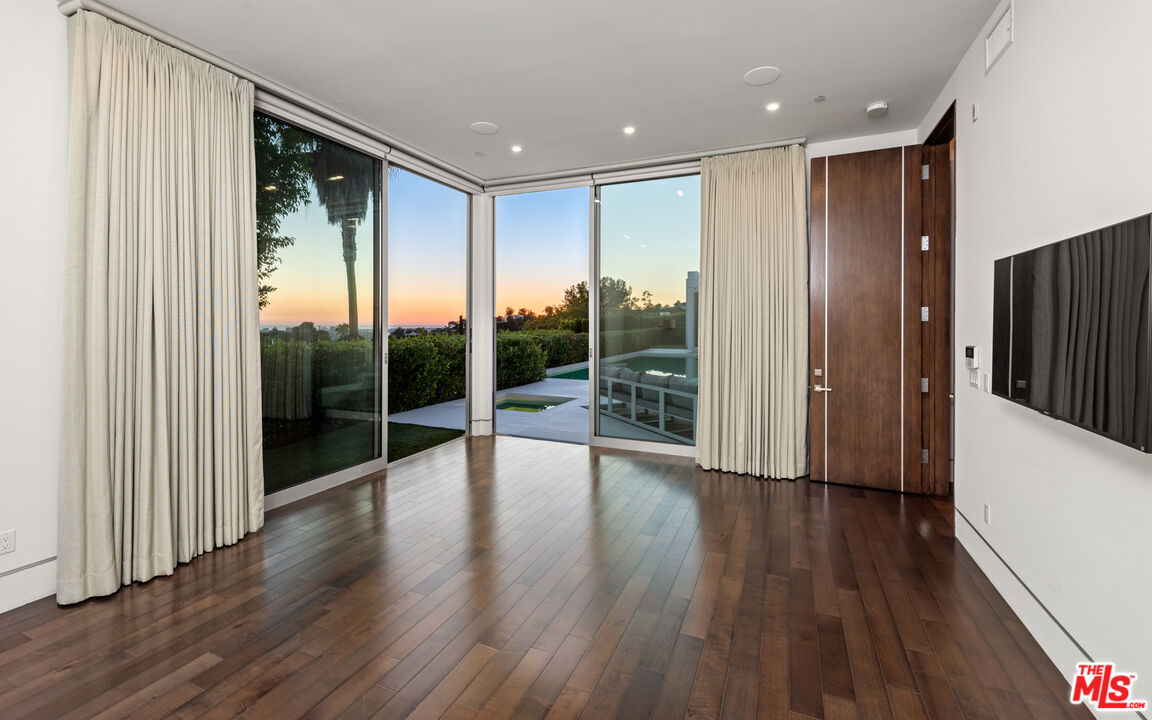 1115 Wallace Ridge Beverly Hills, CA 90210 - Photo 3 of 18 a view of interior space with wooden floor and windows