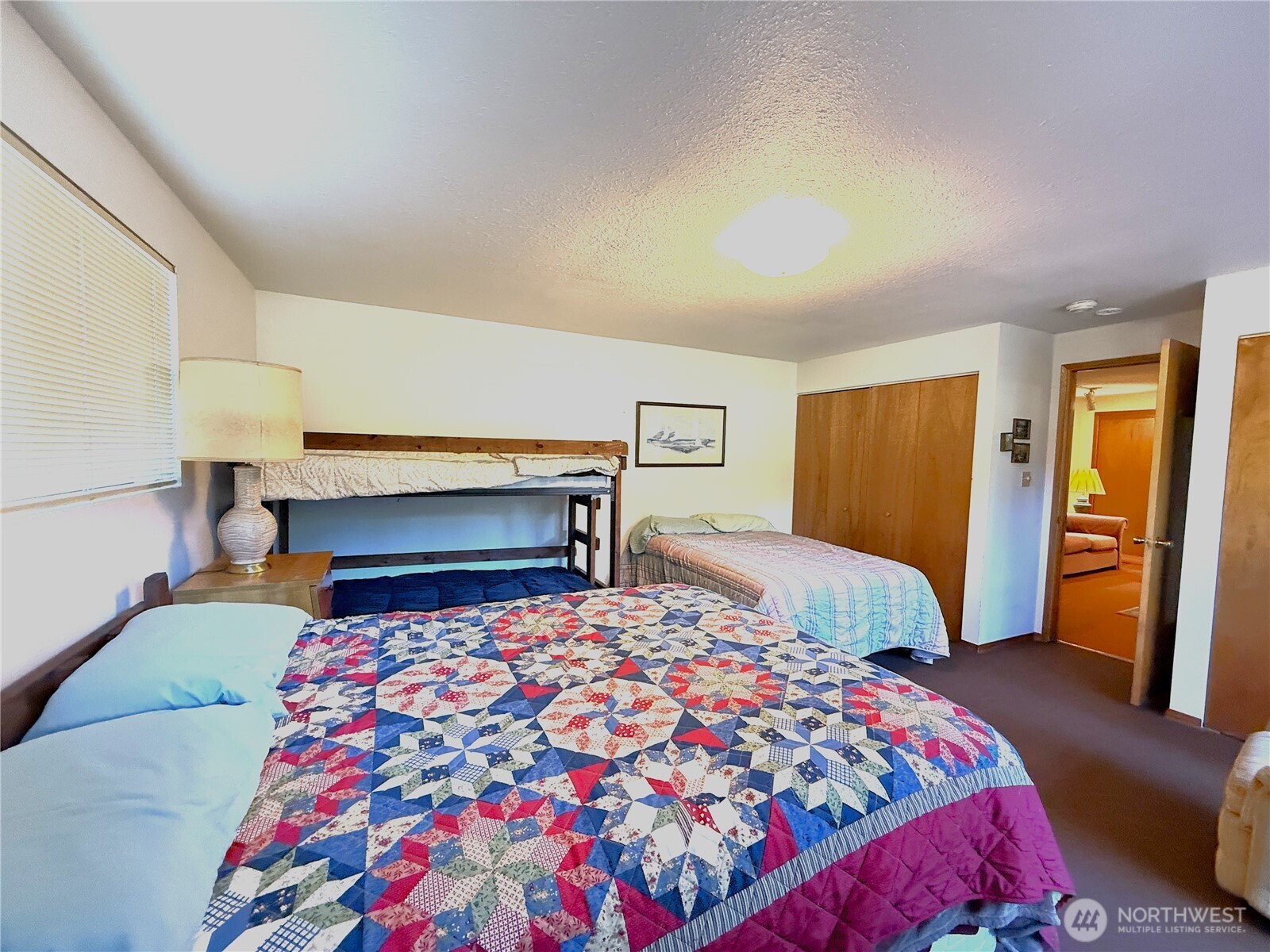 23 Copalis Rv Lane Copalis Beach, WA 98535 - Photo 20 of 40 a bedroom with a bed and a lamp on dresser