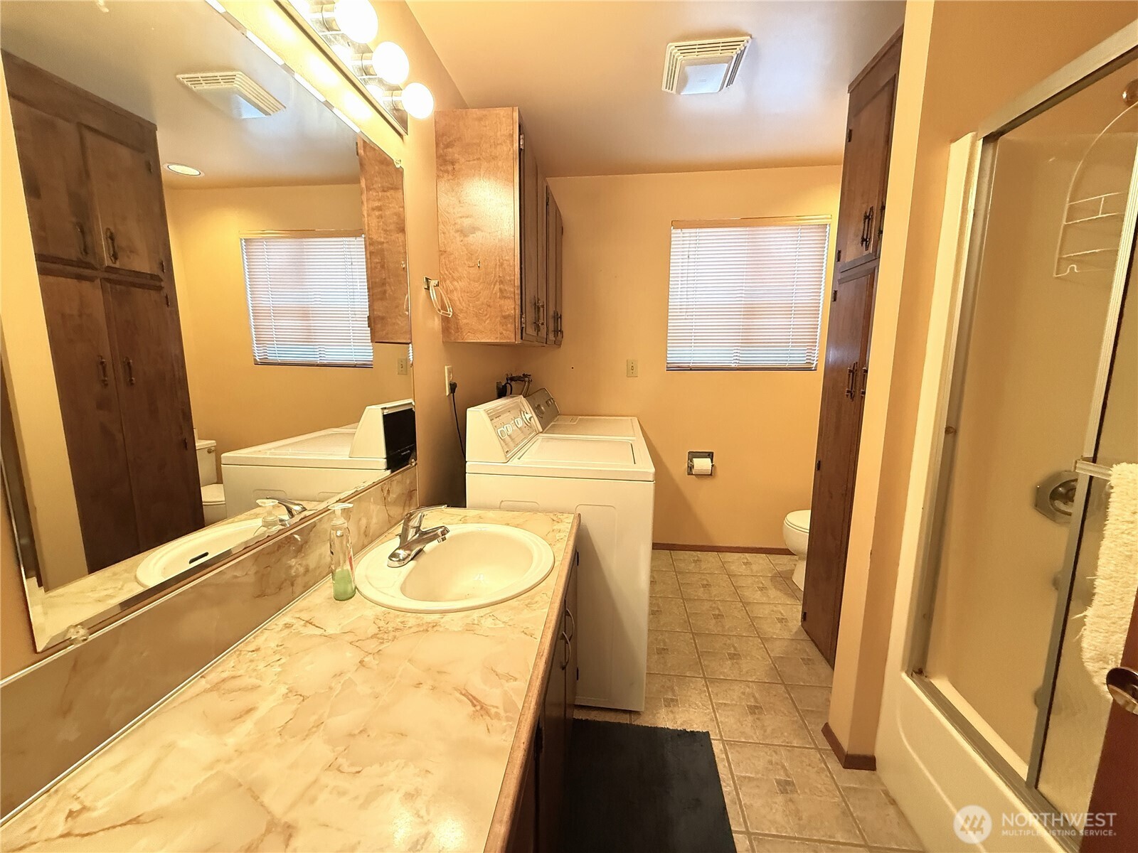 23 Copalis Rv Lane Copalis Beach, WA 98535 - Photo 22 of 40 a bathroom with a granite countertop sink and a mirror