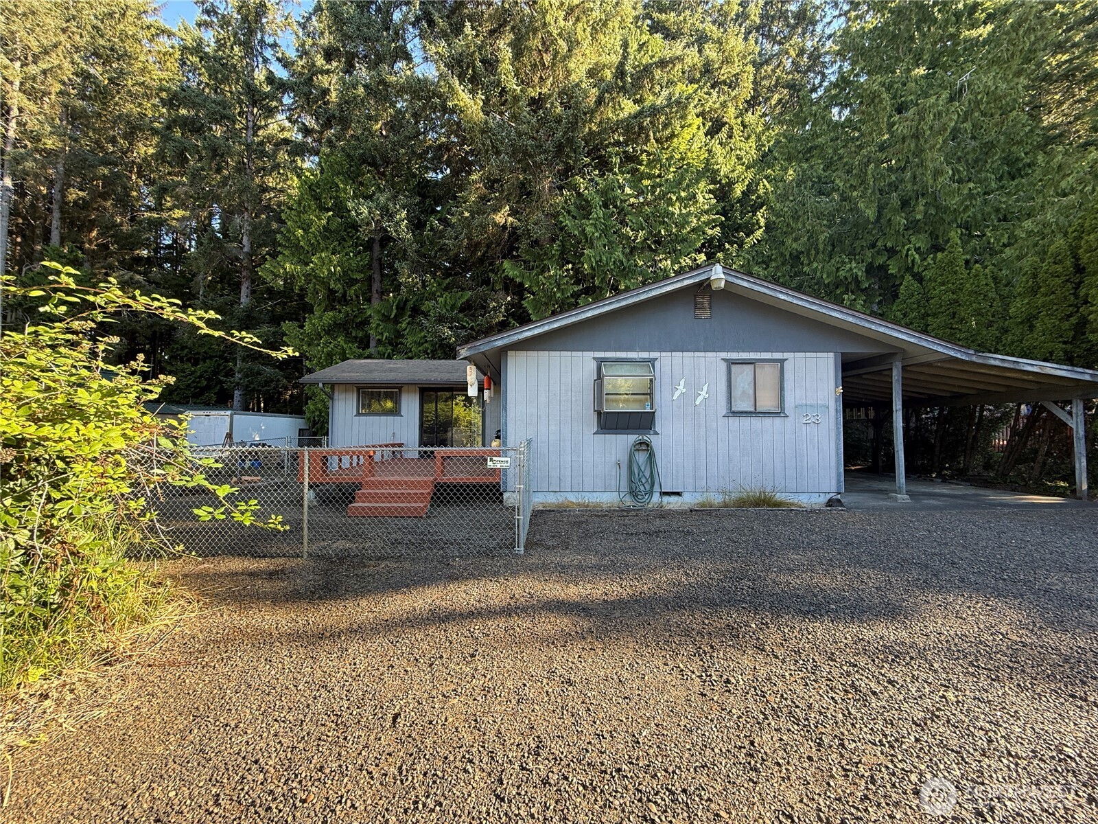 23 Copalis Rv Lane Copalis Beach, WA 98535 - Photo 35 of 40 a view of a house with a yard and large tree