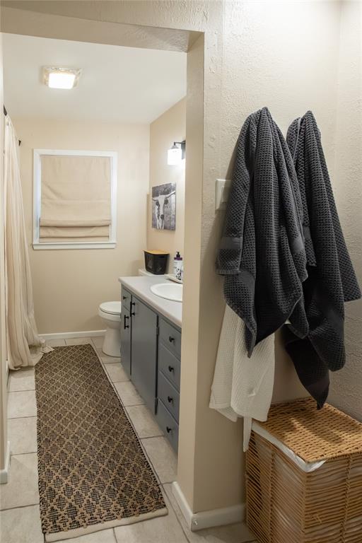 909 Cherry Street Baird, TX 79504 - Photo 23 of 32 a view of walk in closet with clothes and shoes