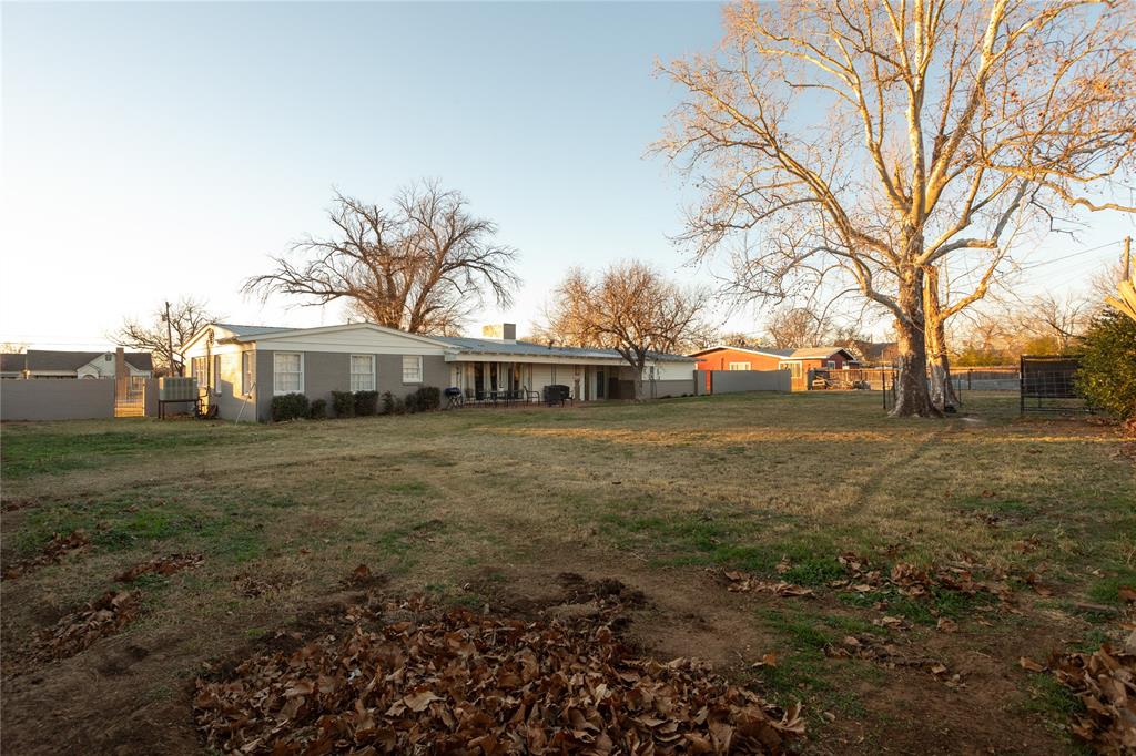 909 Cherry Street Baird, TX 79504 - Photo 26 of 32 a front view of a house with a yard