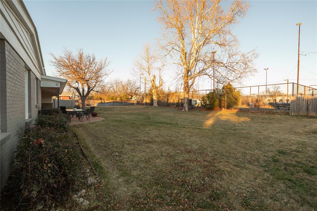 909 Cherry Street Baird, TX 79504 - Photo 27 of 32 a backyard of a house with lots of green space