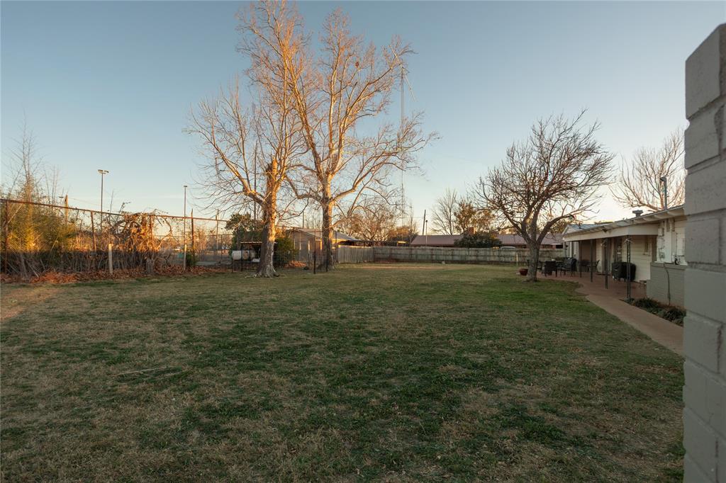 909 Cherry Street Baird, TX 79504 - Photo 29 of 32 a view of a yard in front of a house