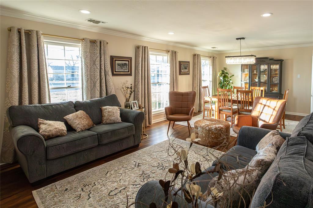 909 Cherry Street Baird, TX 79504 - Photo 7 of 32 a living room with furniture and large windows