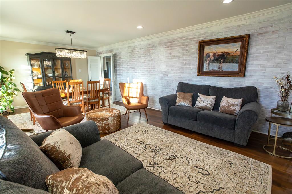 909 Cherry Street Baird, TX 79504 - Photo 8 of 32 a living room with furniture and a rug