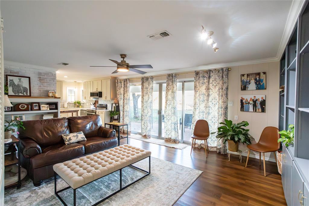 909 Cherry Street Baird, TX 79504 - Photo 9 of 32 a living room with furniture and a large window