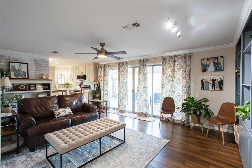 909 Cherry Street Baird, TX 79504 - Photo 10 of 32 a living room with furniture and wooden floor