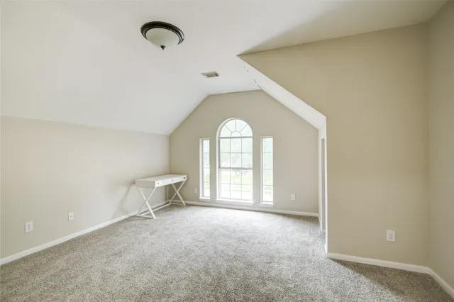 a view of empty room with windows