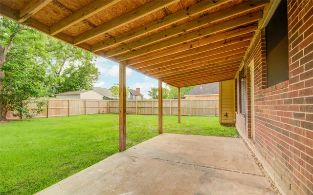 a view of a backyard of the house