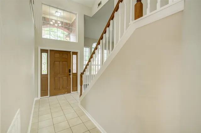 a view of an entryway with wooden floor