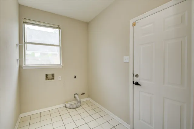 a view of an empty room with closet area