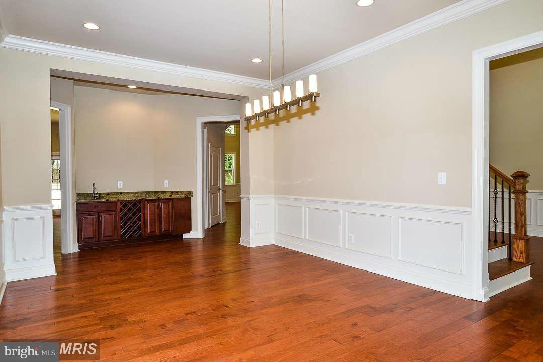 8536 Old Keene Mill Road Springfield, VA 22152 - Photo 14 of 30 a view of a hallway with cabinet and a living room