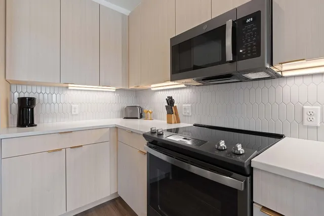 a kitchen with a stove and a microwave