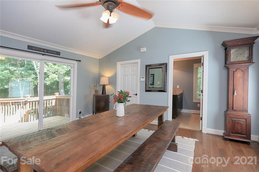 155 Agnew Road Mooresville, NC 28117 - Photo 13 of 37 a dining room with wooden floor and large windows