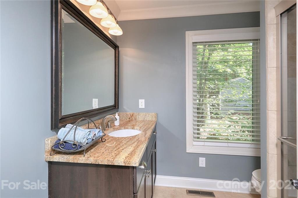 155 Agnew Road Mooresville, NC 28117 - Photo 18 of 37 a bathroom with a granite countertop sink and a mirror