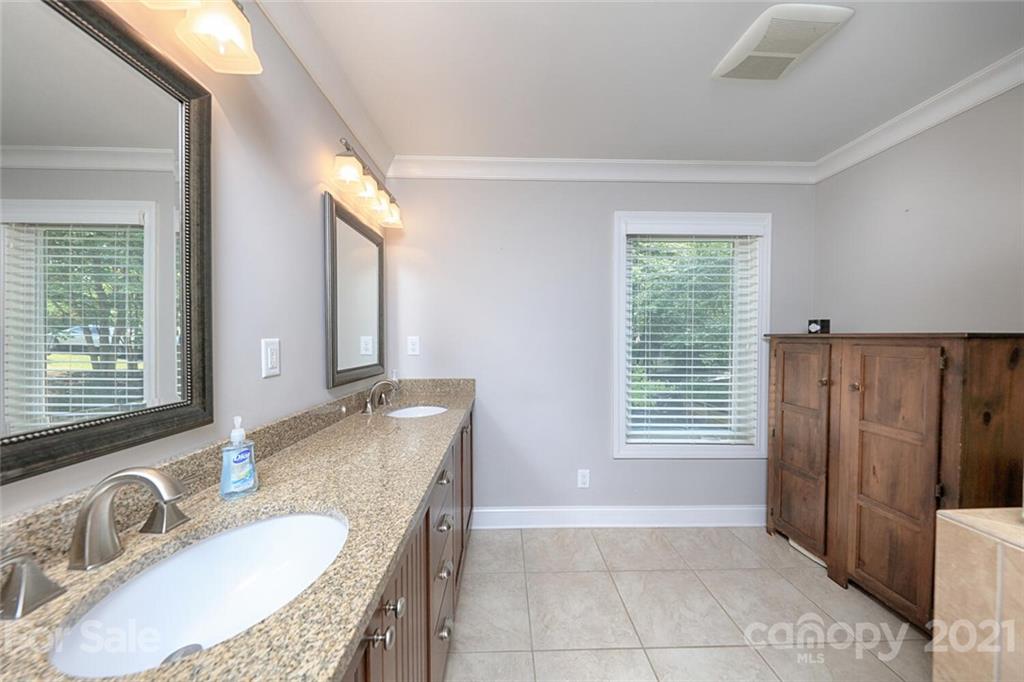 155 Agnew Road Mooresville, NC 28117 - Photo 22 of 37 a bathroom with a granite countertop sink and a mirror