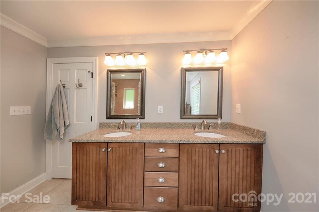 155 Agnew Road Mooresville, NC 28117 - Photo 23 of 37 a bathroom with a granite countertop sink and a mirror