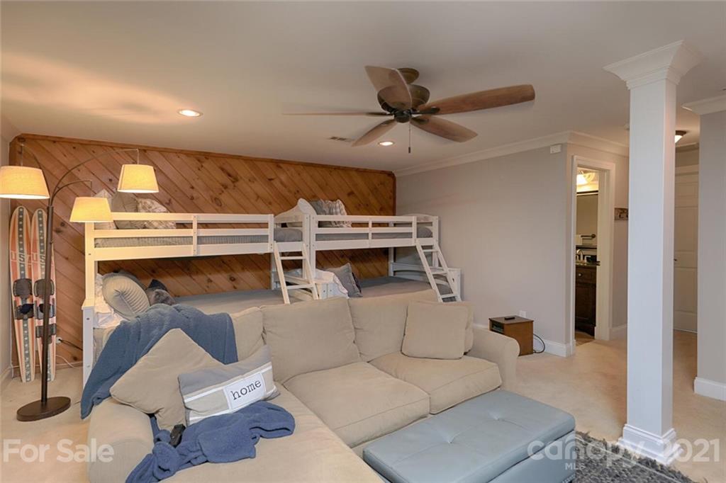 155 Agnew Road Mooresville, NC 28117 - Photo 26 of 37 a living room with furniture a ceiling fan and a rug