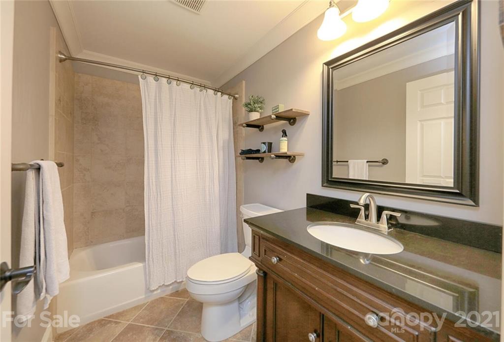 155 Agnew Road Mooresville, NC 28117 - Photo 28 of 37 a bathroom with a granite countertop sink toilet and shower