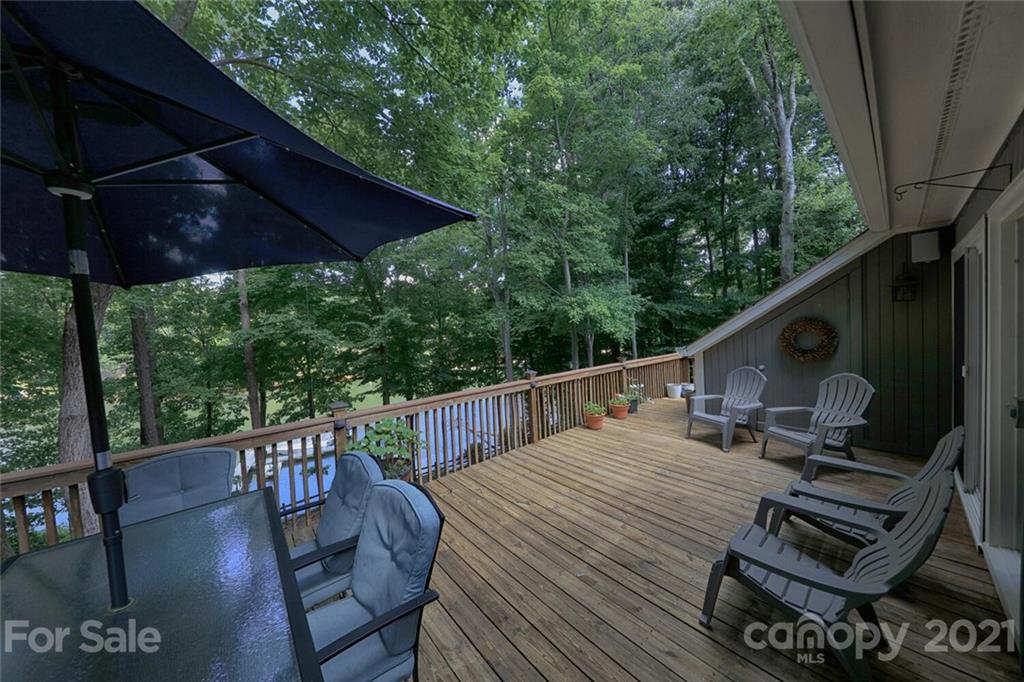 155 Agnew Road Mooresville, NC 28117 - Photo 9 of 37 a view of balcony with wooden floor and outdoor seating