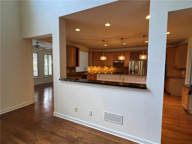a view of a livingroom with a ceiling fan and a rug