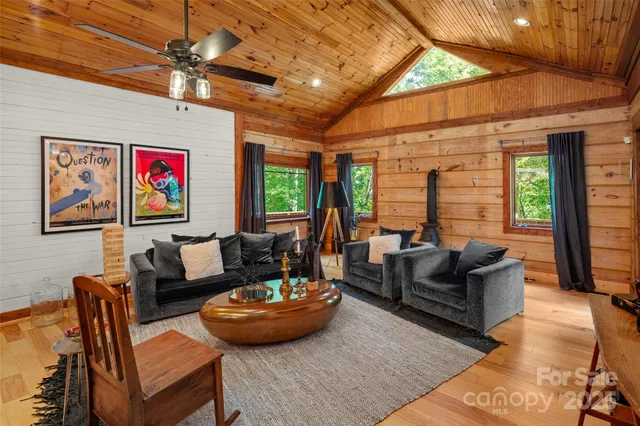 a living room with furniture and kitchen view