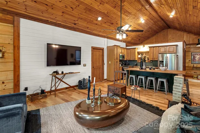 a dining table with chairs and a refrigerator