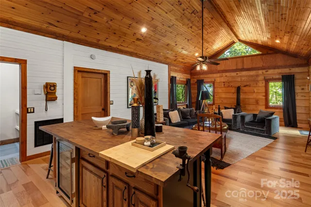 a dining table with chairs and wooden floor