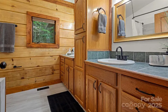 a bathroom with a bathtub and shower