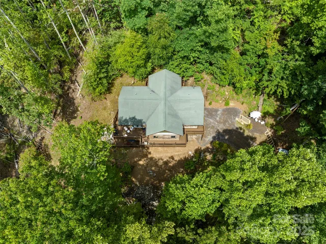 a view of a green field with lots of bushes