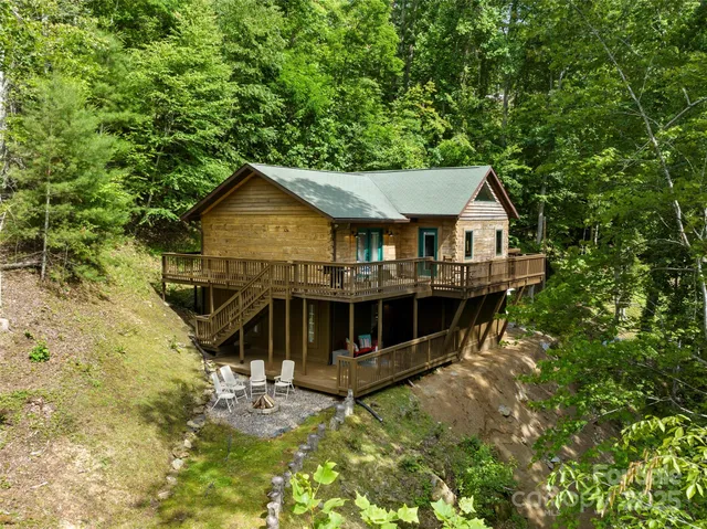 a view of house with outdoor space and sitting area