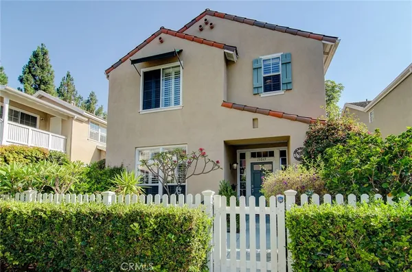 front view of a house with potted plants