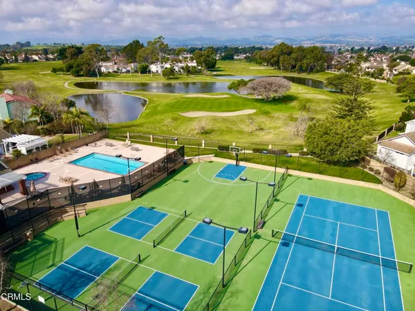 a view of a chairs and table in the garden