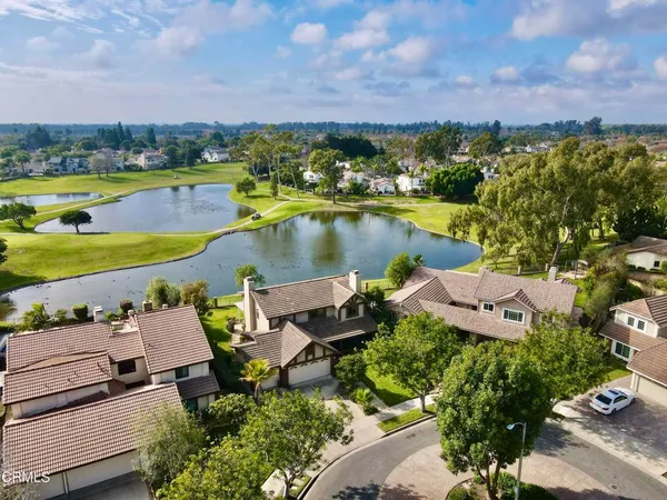 an aerial view of a house with a lake view