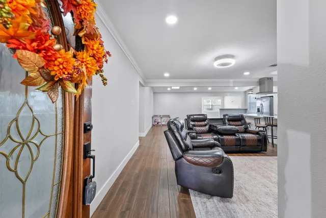 a lobby with furniture and a potted plant