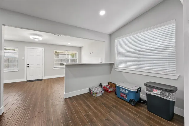 a room with furniture and a wooden floor