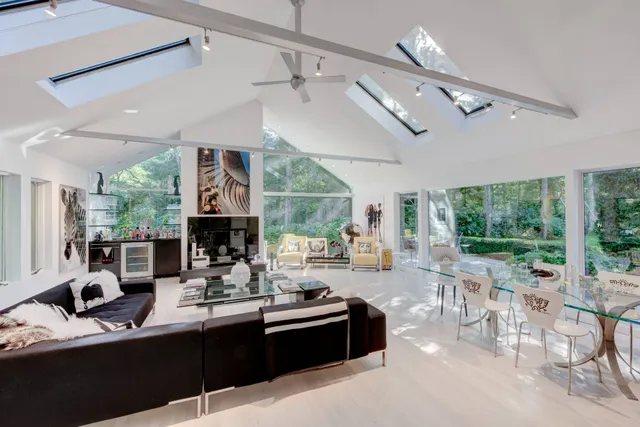 a kitchen with a sink appliances and a large window