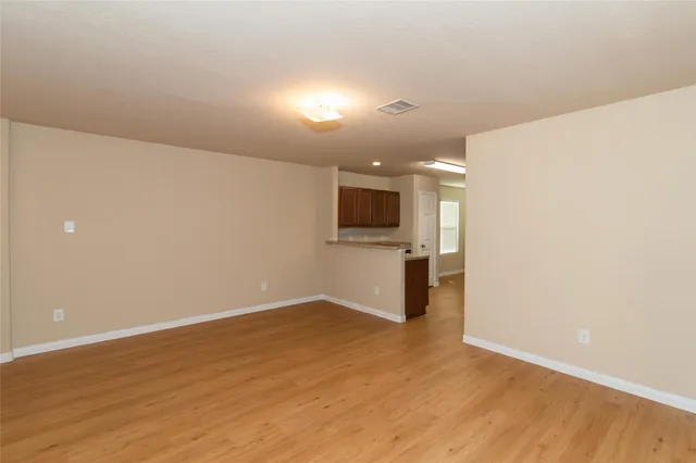 a view of a kitchen with a sink and a microwave
