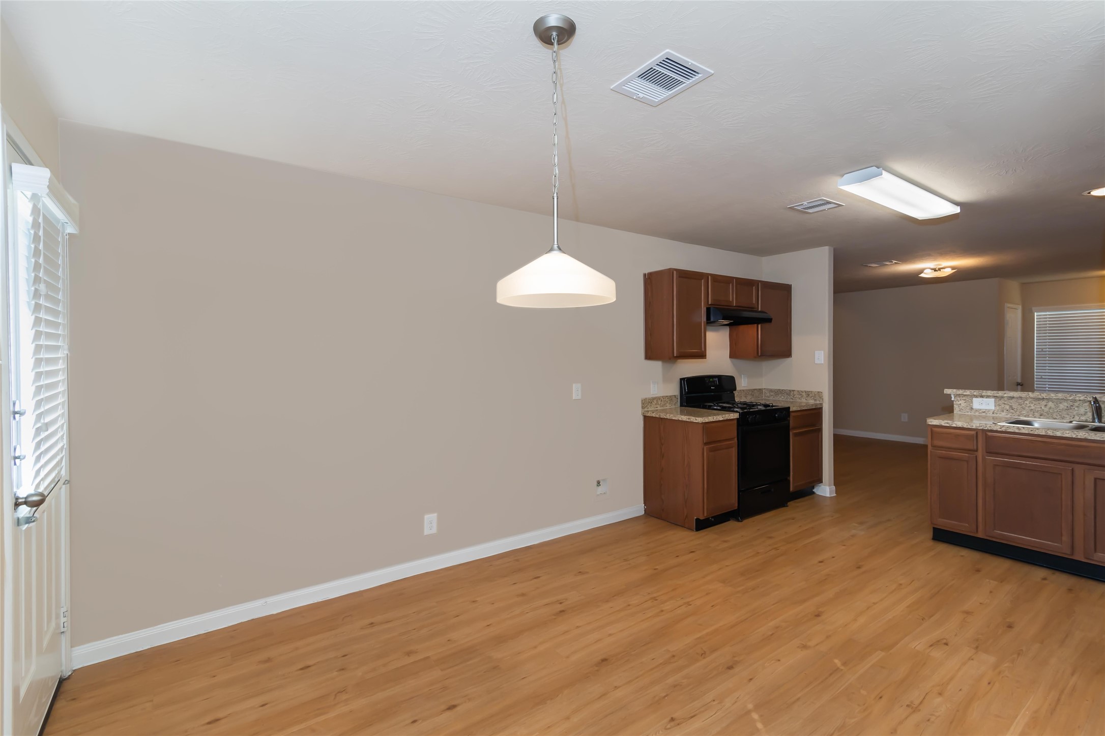 2410 Gibbs Bend Court Houston, TX 77073 - Photo 6 of 12 a kitchen with kitchen island a counter top space a sink and stainless steel appliances
