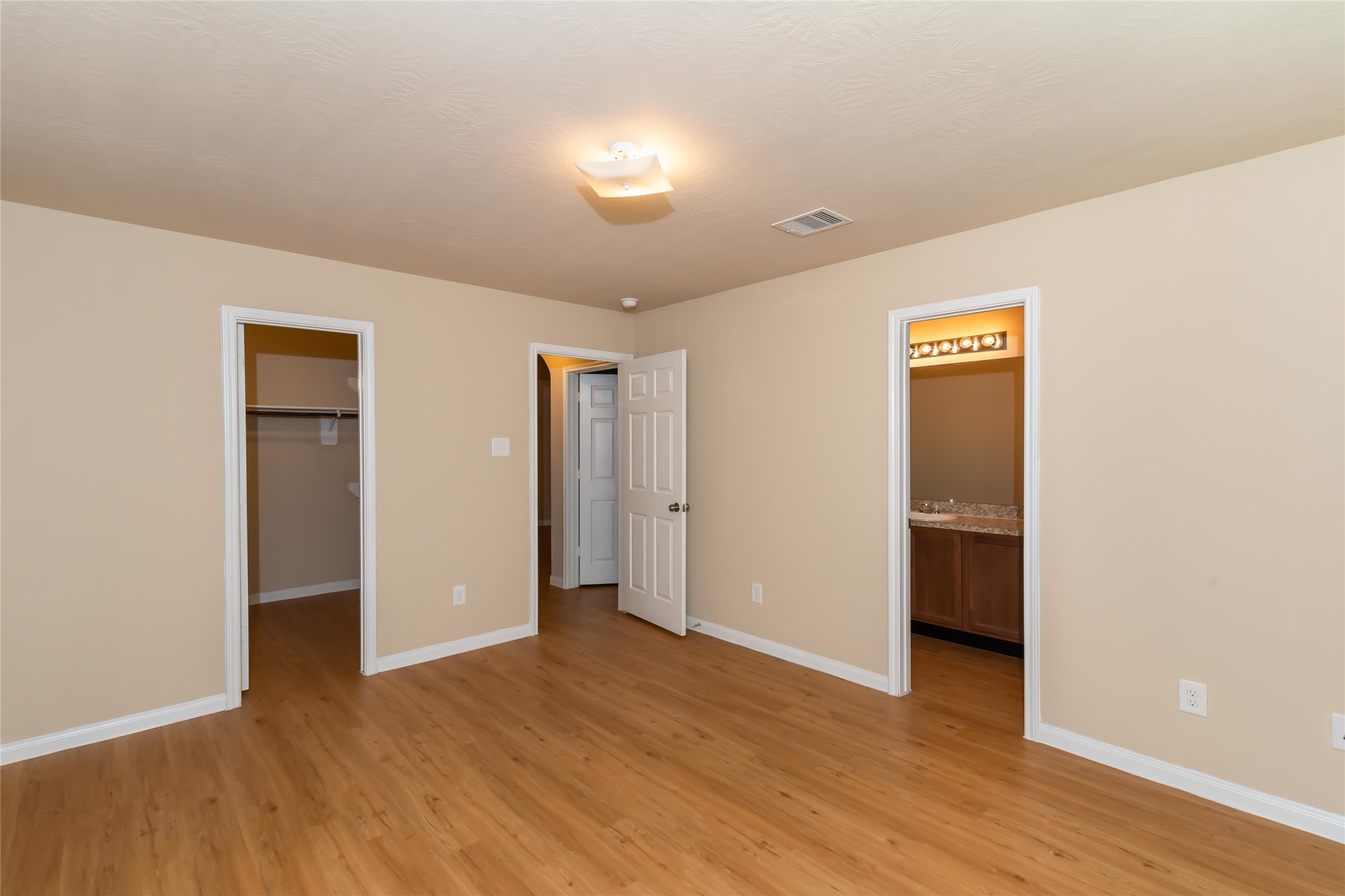 2410 Gibbs Bend Court Houston, TX 77073 - Photo 7 of 12 a view of an empty room with wooden floor and closet