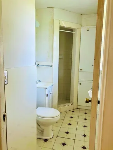 a view of a livingroom with a ceiling fan and window