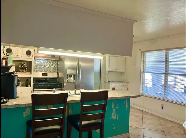 a view of a dining table and chairs