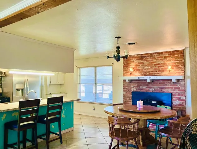a view of a dining room with furniture and window