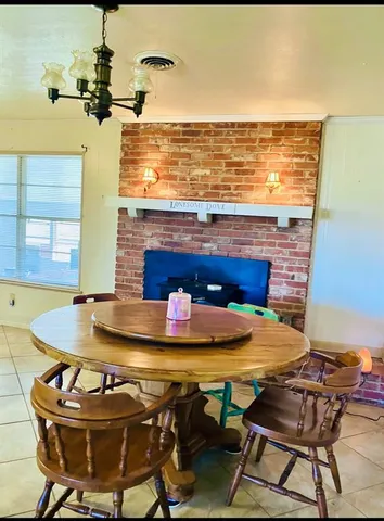 a view of a dining room with furniture and a table