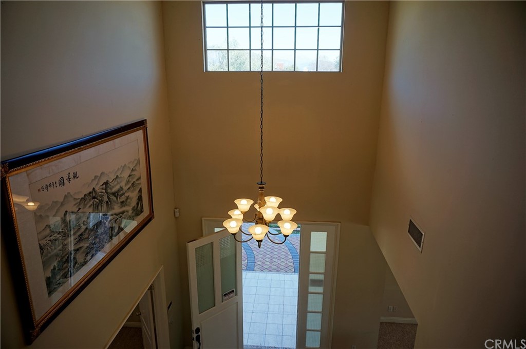 705 Cortez Road Arcadia, CA 91007 - Photo 17 of 70 a vase of flowers sitting on a shelf