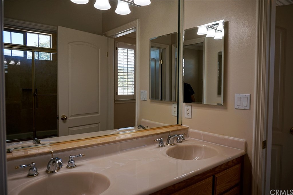705 Cortez Road Arcadia, CA 91007 - Photo 20 of 70 a bathroom with a sink and a mirror